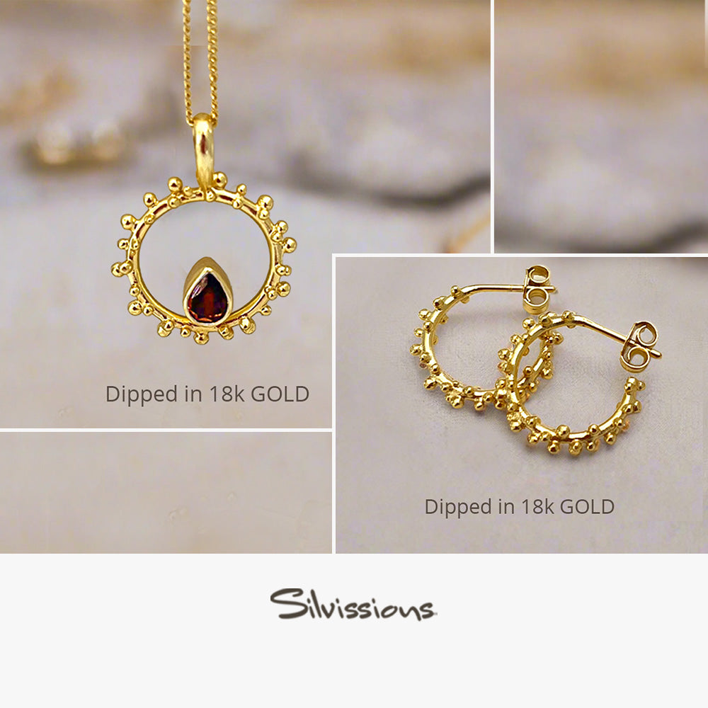 Gold jewelry set with 'Dipped in 18k Gold' text and Silvassions branding.