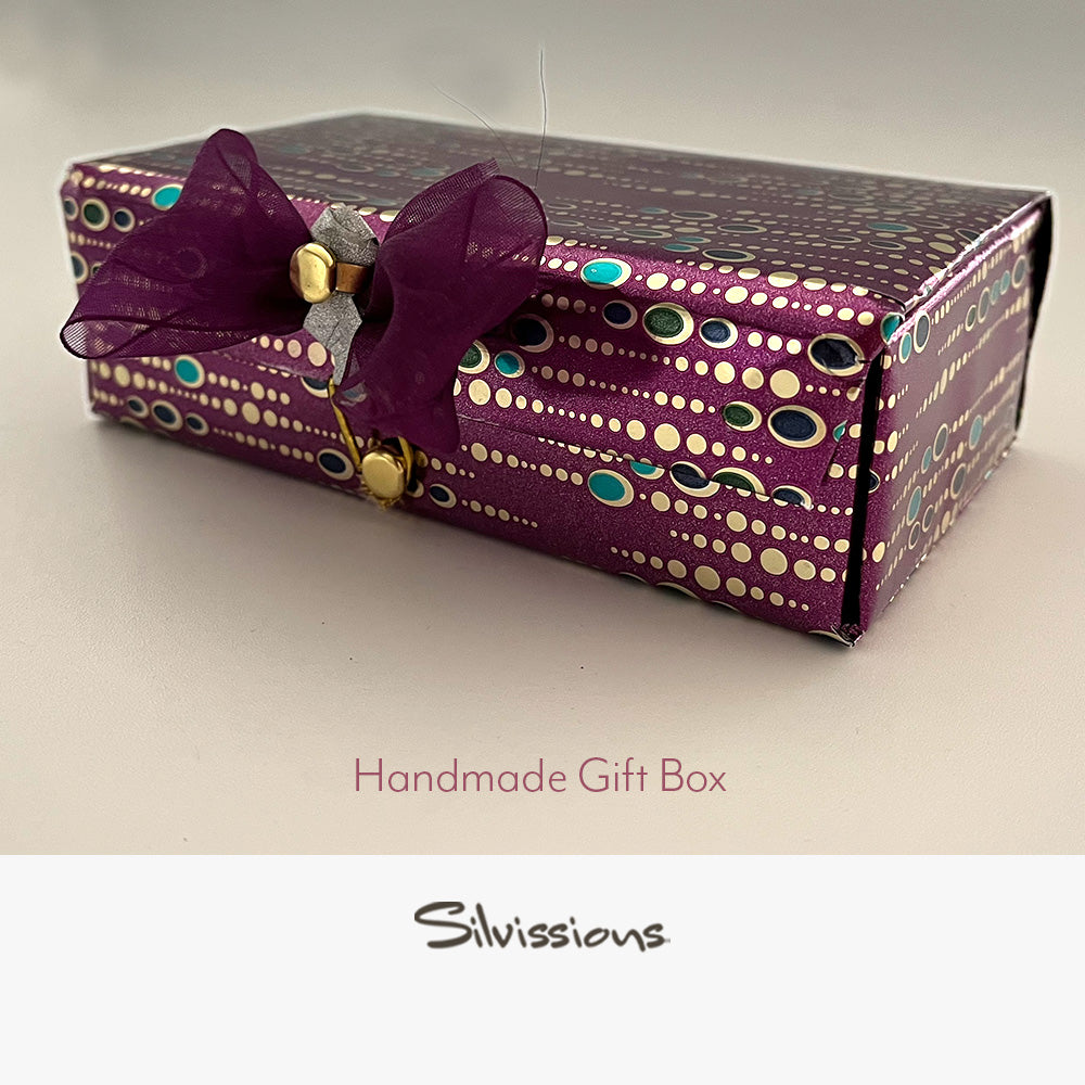 Handmade gift box with decorative bow on a neutral background, branded 'Silvissions'.