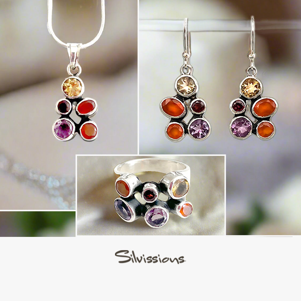 Jewelry set with colorful gemstones on a blurred background, featuring the brand 'Silvissions'.