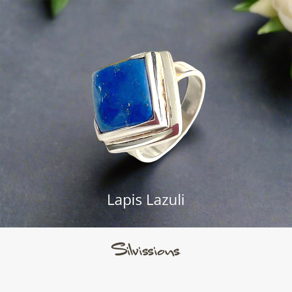 Silver ring with blue lapis lazuli stone on a dark background, branded 'Silvissions'.