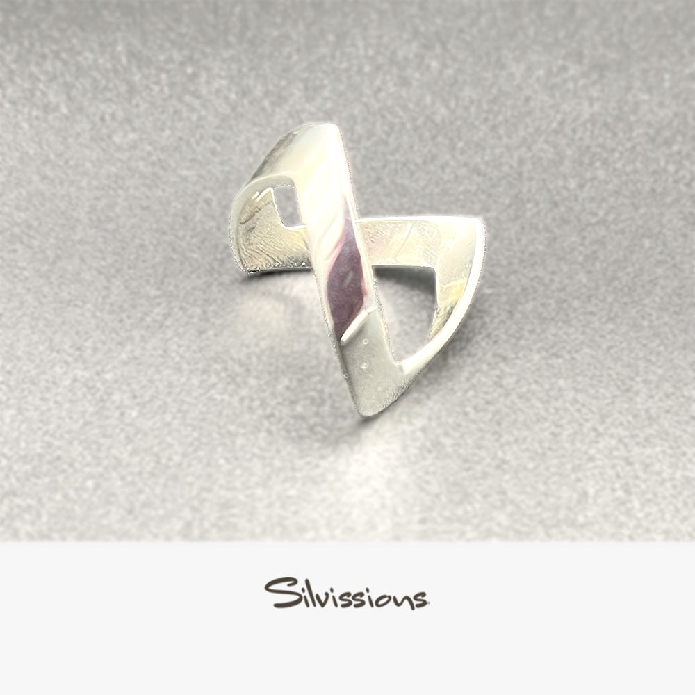 Silver ring with a unique design on a gray background, branded 'Silvissions'.