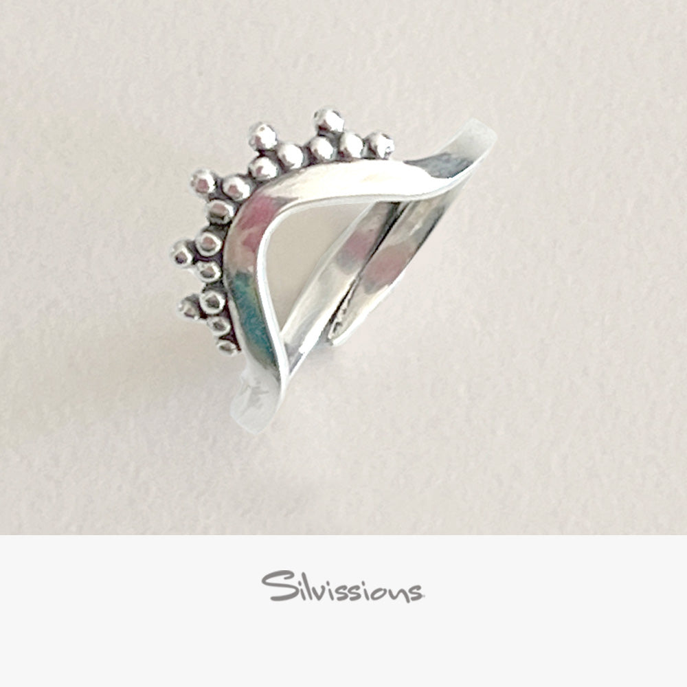 Silver ring with a unique design on a light gray background, featuring the brand 'Silvissions'.