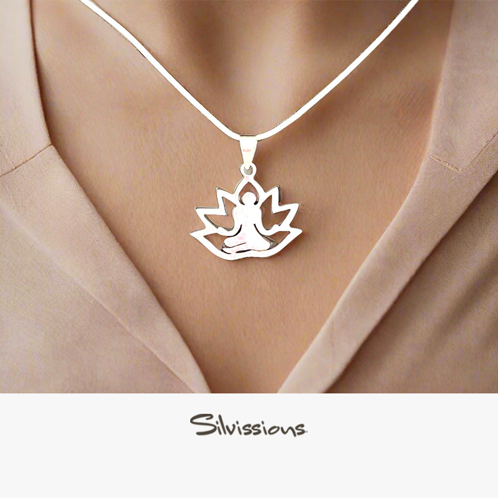 Silver pendant necklace with a yoga design worn by a person, brand 'Silvissions' visible.