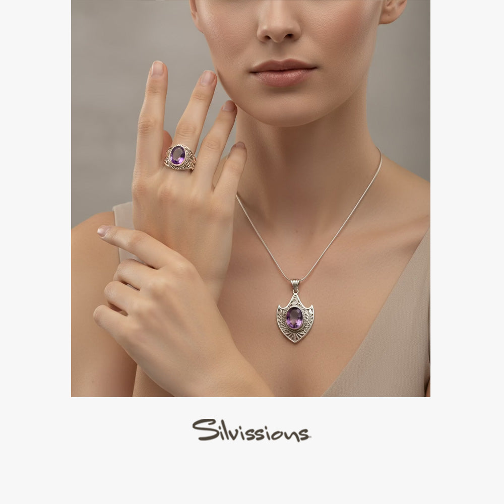 Woman wearing a silver necklace with a purple pendant and matching ring, with 'Silvassions' branding.