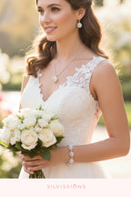 Woman wearing jewelry with a blurred floral background, featuring the brand 'Silvission'.