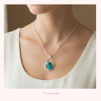 Necklace with a turquoise pendant worn by a person, brand 'Silvissions' visible