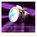 Ring with rainbow moonstone on a purple fabric background, featuring the brand 'Silvissions'.