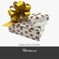 Handmade gift box with gold accents and a gold ribbon on a beige background, branded 'Silviussions'.
