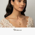Woman wearing gold jewelry with a neutral background, featuring the brand 'Silvissions'.