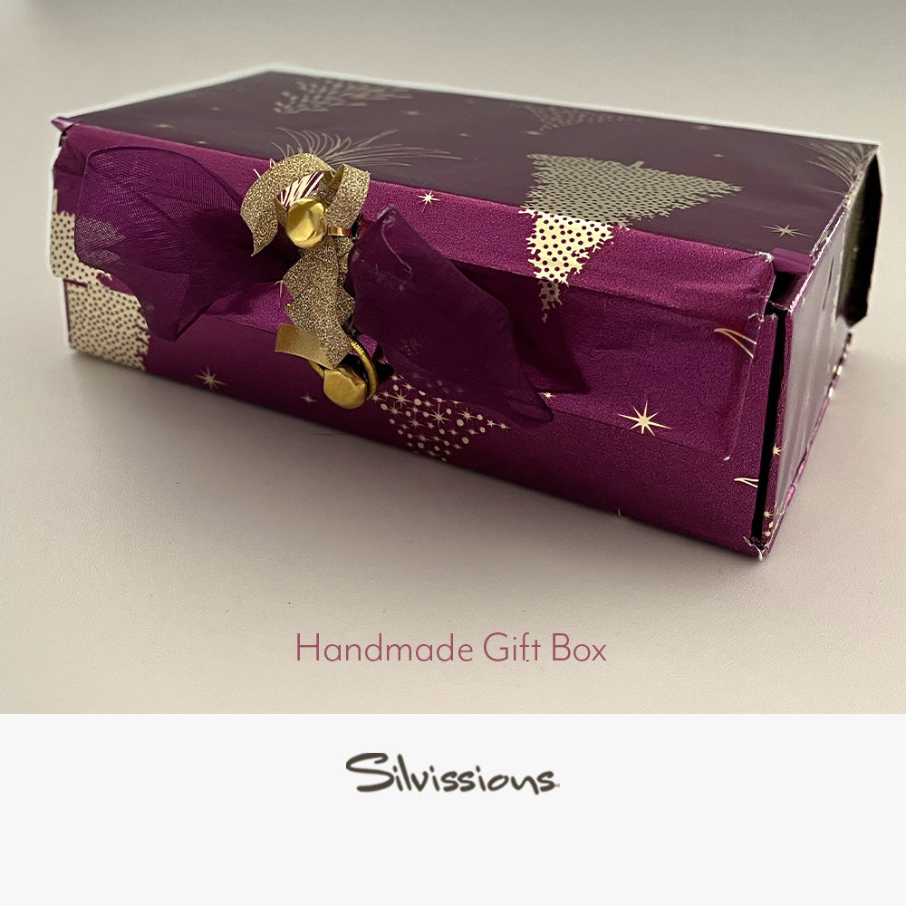 Handmade gift box with gold accents on a neutral background, branded 'Silvissions'.
