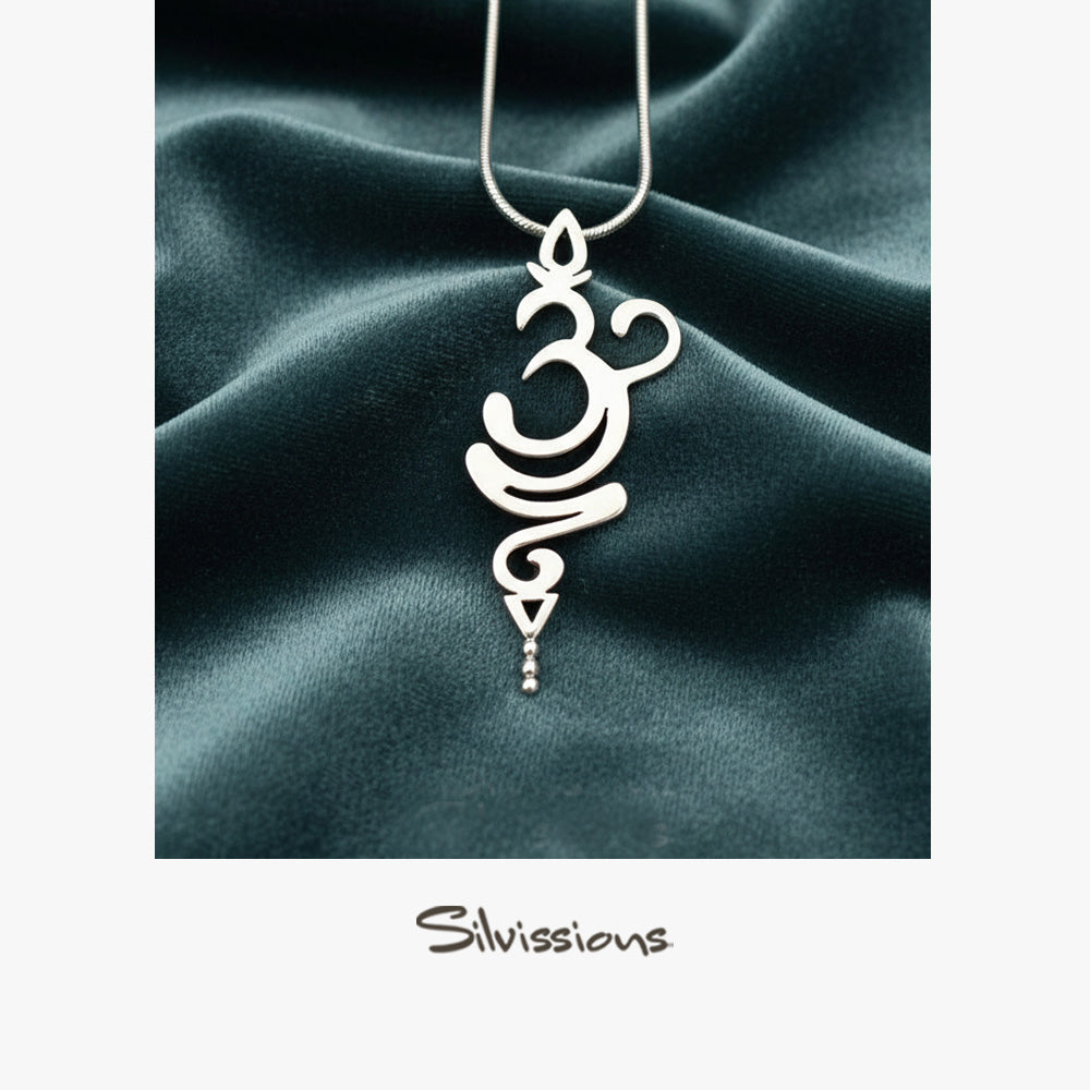 Silver pendant necklace on a dark green fabric background with 'Silvissions' branding.