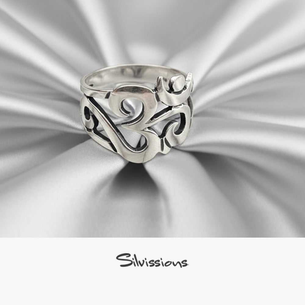 Silver ring with intricate design on a metallic silver background, featuring the brand 'Silvissions'.