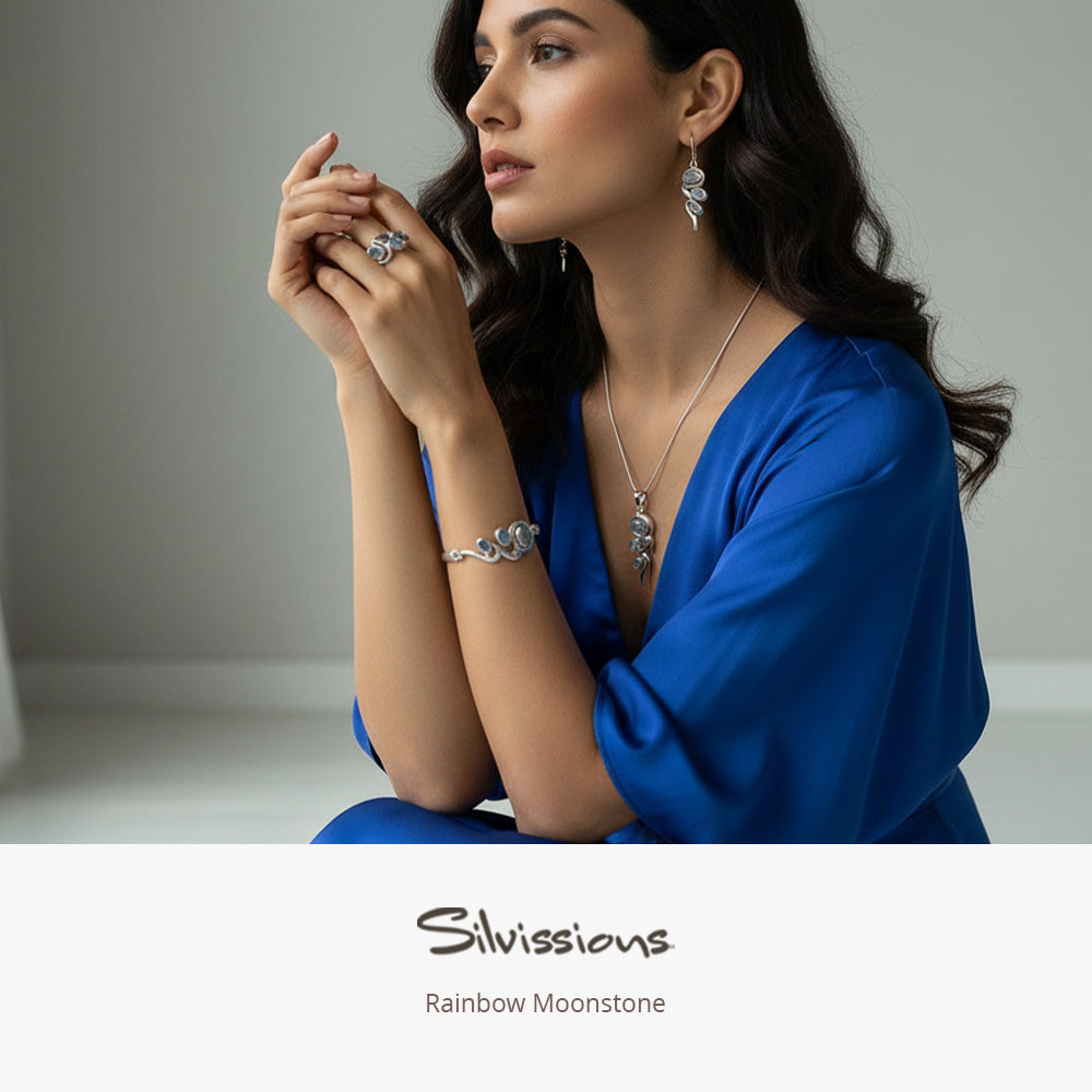 Woman wearing jewelry with 'Silviossions' branding on a neutral background