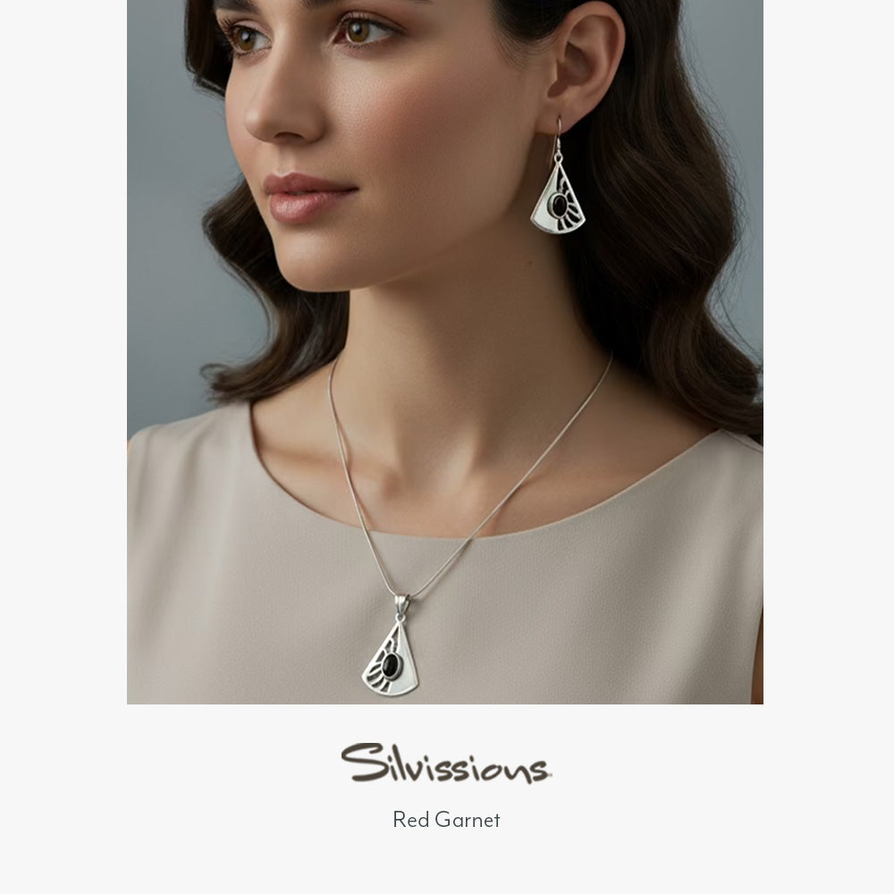 Woman wearing silver necklace and earrings with 'Silvissions' branding.