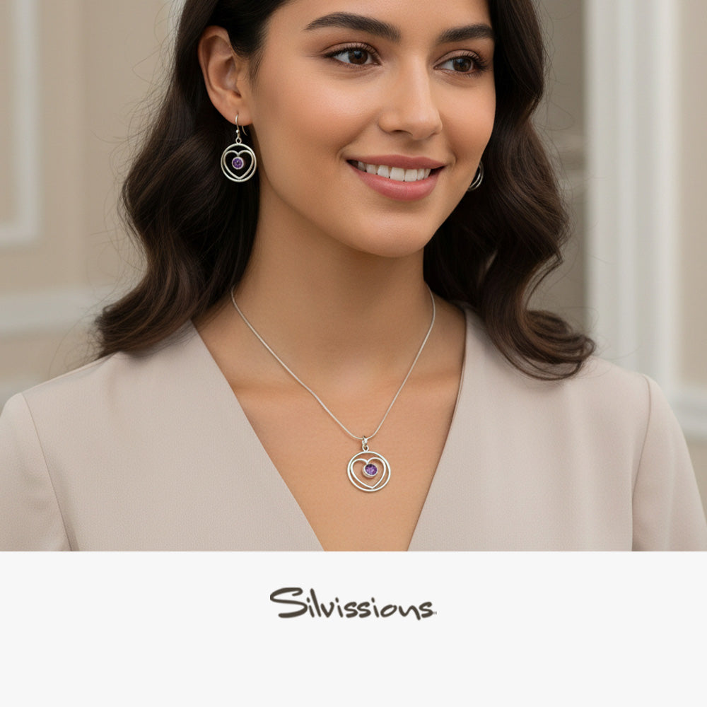 Woman wearing a necklace and earrings with 'Silvissions' branding.