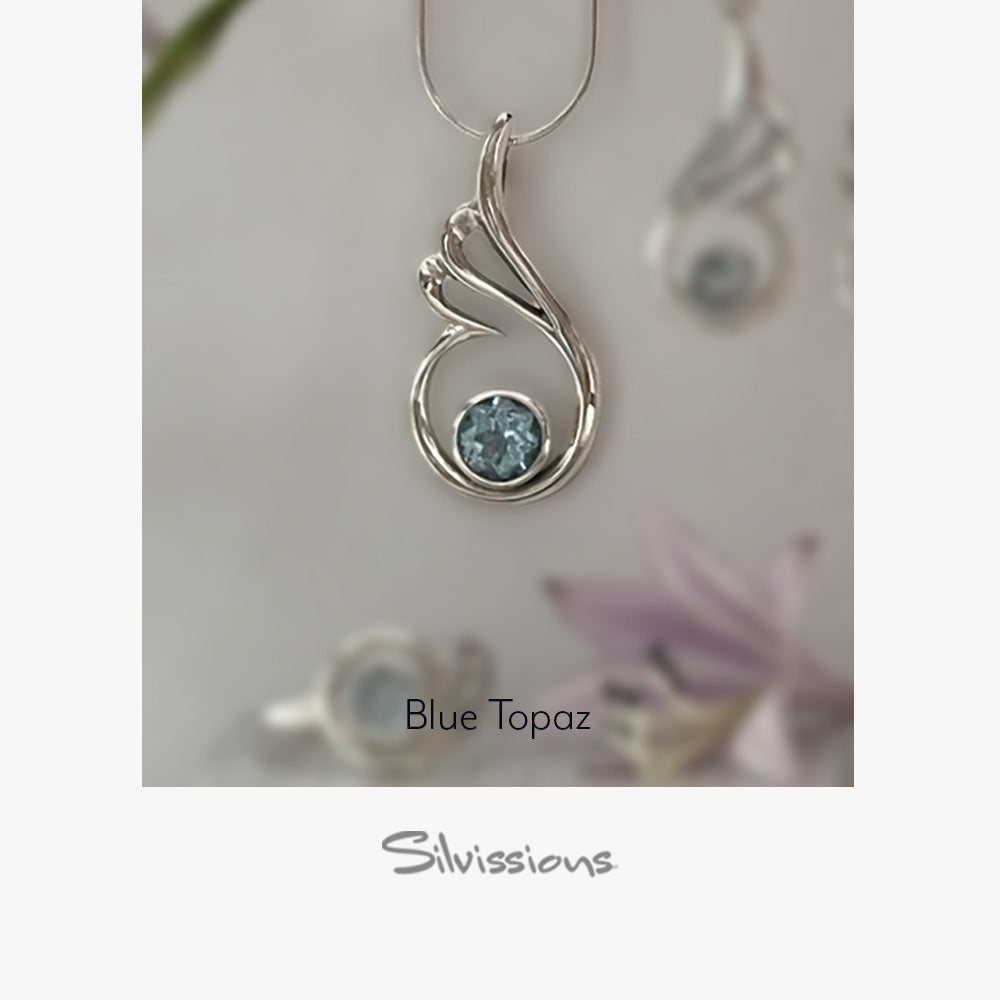 Silver pendant with blue gemstone on a white background, featuring the brand 'Silvissions'.