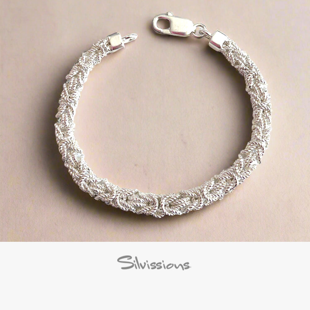 Silver bracelet on a beige background with 'Silvissions' branding.