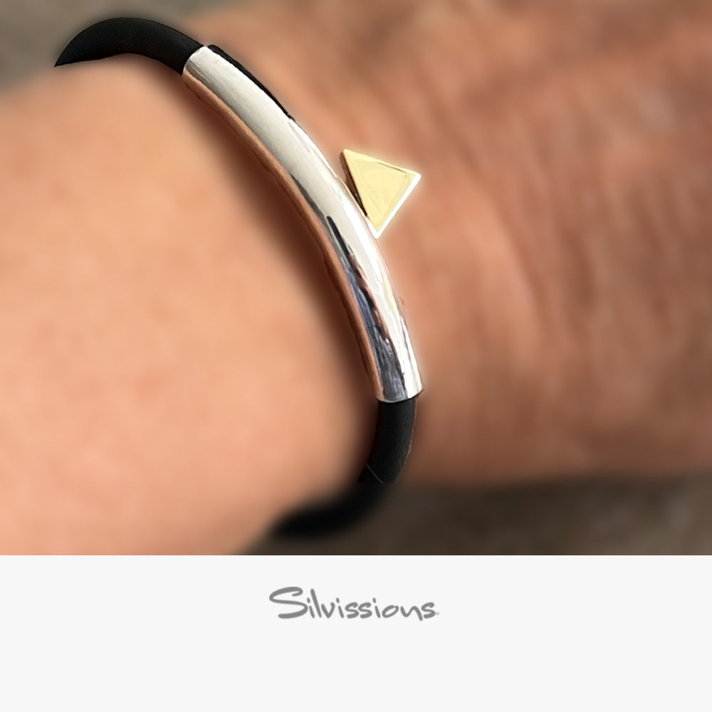 Silver and black bracelet with a gold triangle on a wrist, featuring Silvessions jewelry branding.