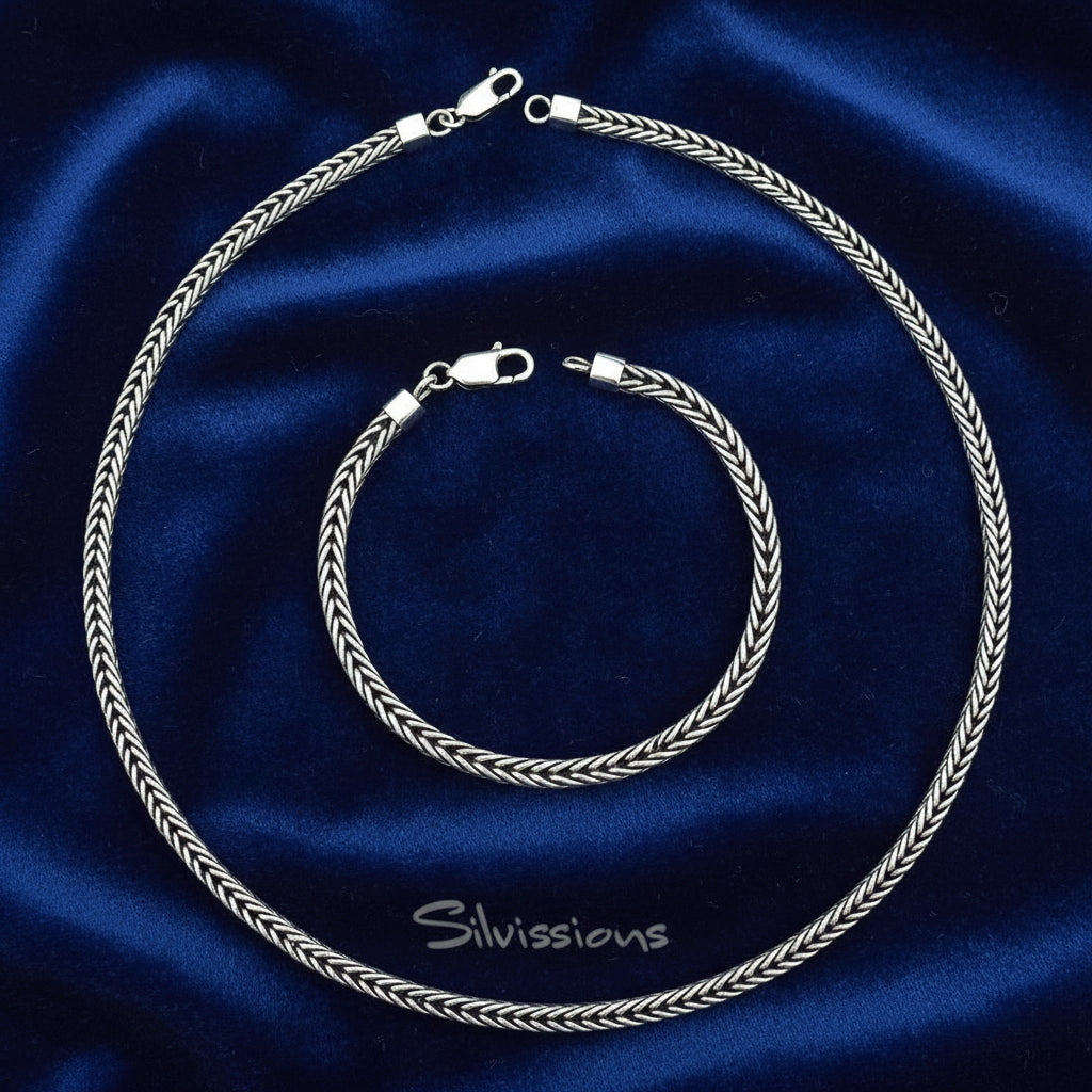 Silver necklace and bracelet set on a blue background with 'Silvissions' branding.