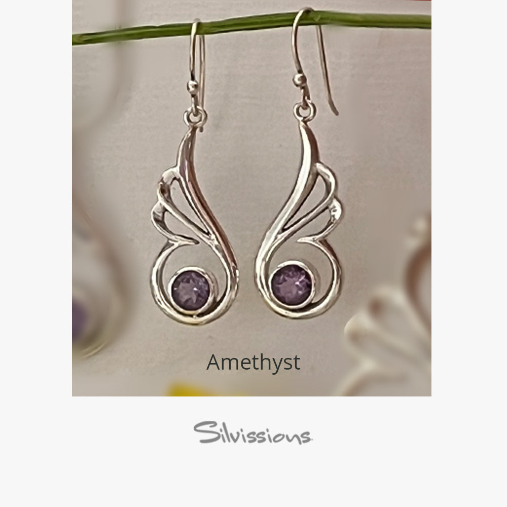 Silver earrings with purple gemstones on a floral background, labeled 'Amethyst' and 'Silvissions'.