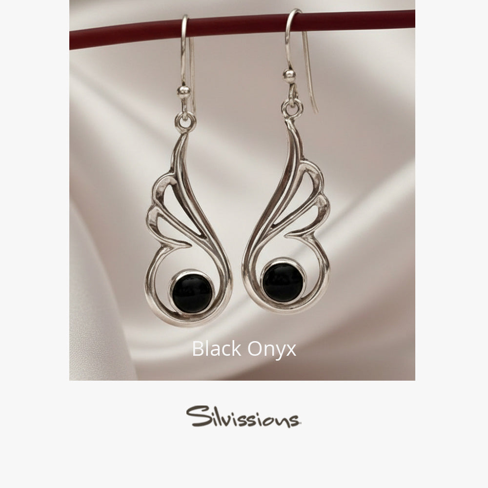 Silver earrings with black gemstones on a white background, branded 'Silvissions'.