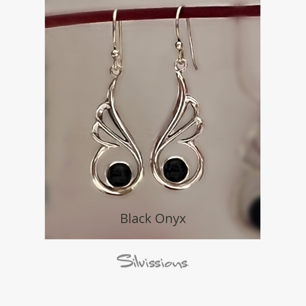 Silver earrings with black stones on a beige background, labeled 'Black Onyx' by Silvissions.