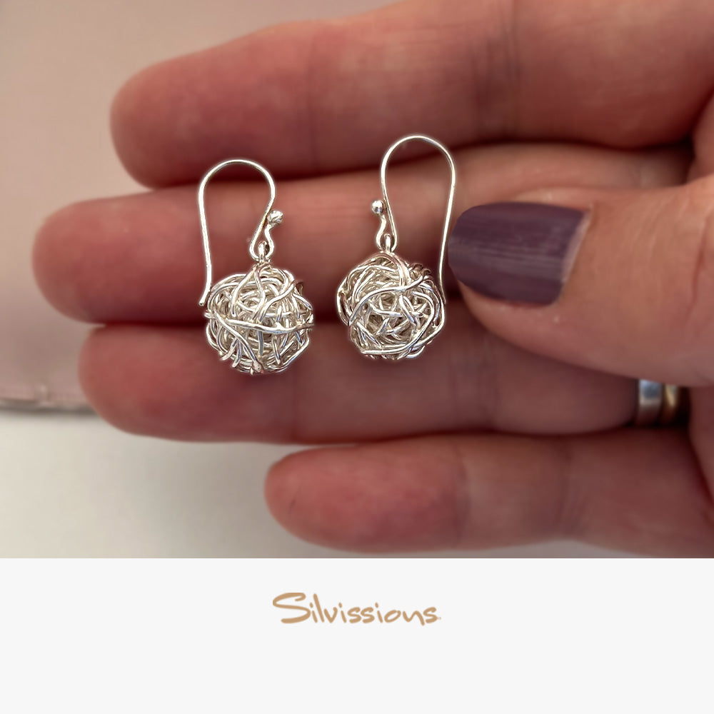 sterling-silver-dangle-earrings-for-women-E-40-hand-height-1000-width-1000