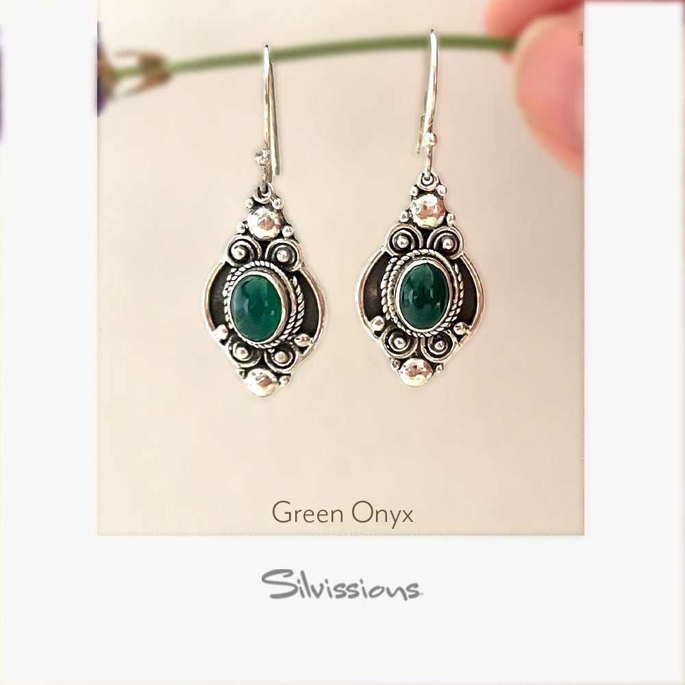 Green onyx earrings with silver detailing on a Silvissions branded card.