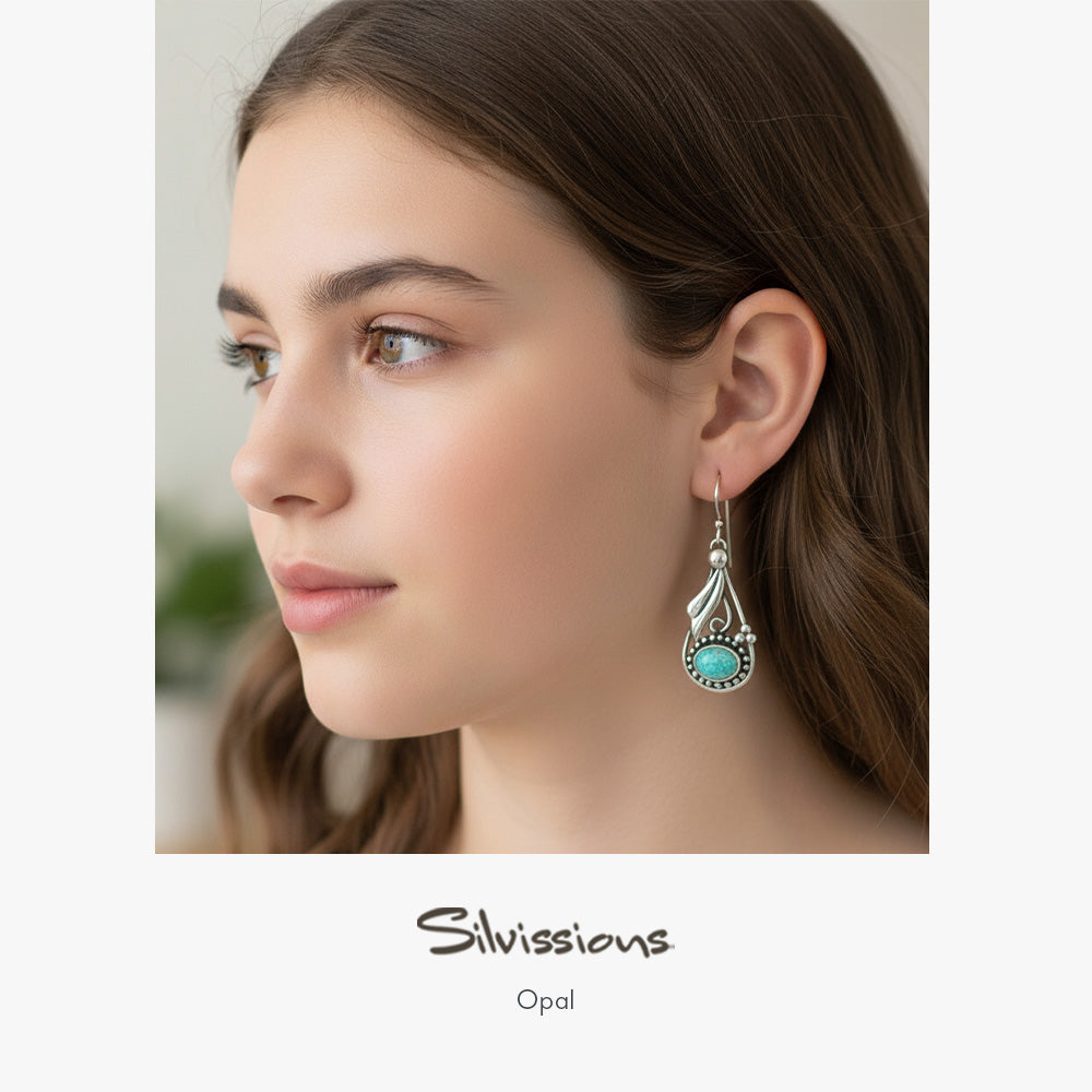 Teen Girl wearing an opal earring with 'Silvissions' branding