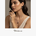 Woman wearing jewelry with 'Silvassions' branding