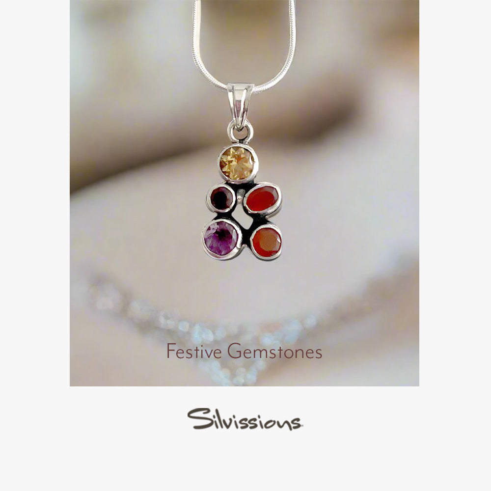 Silver necklace with gemstone pendant on a soft background, featuring the brand 'Silvissions'.