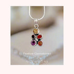 Silver necklace with gemstone pendant on a soft background, featuring the brand 'Silvissions'.