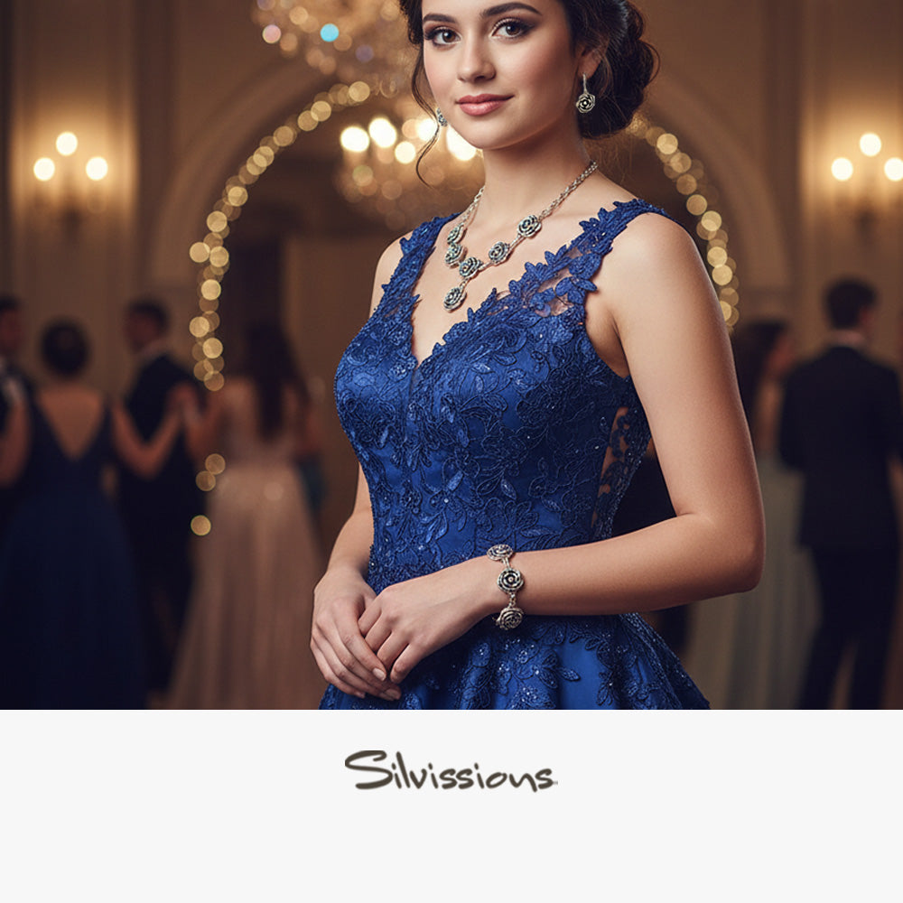 Woman in a blue lace dress with jewelry in an elegant indoor setting, featuring the brand 'Silvissions'.