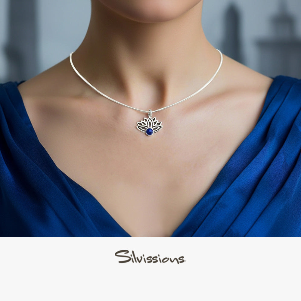 Necklace with a lotus flower pendant featuring lapis lazuli stone on a model, branded 'Silvissions'.