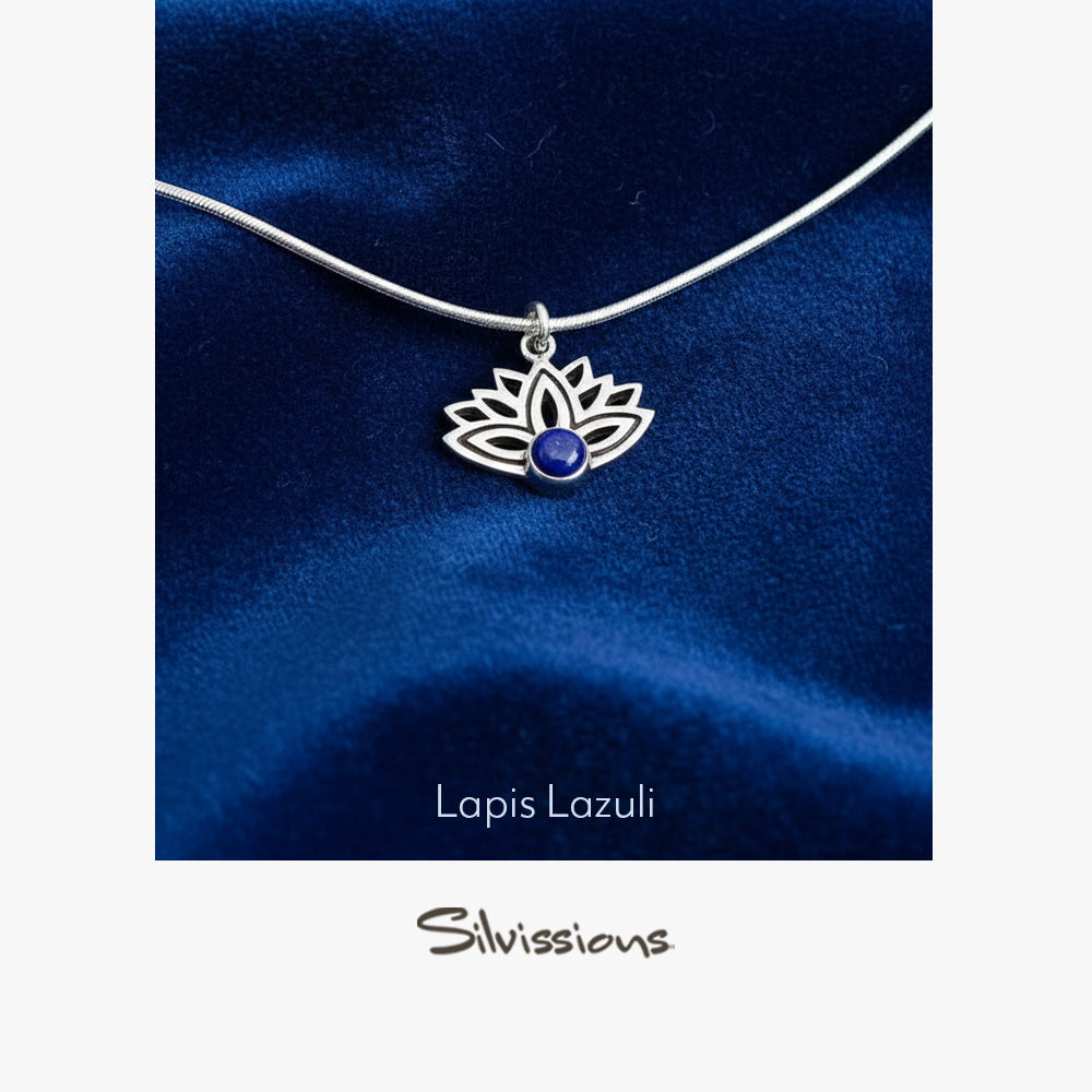 Silver necklace with a lapis lazuli pendant on a blue satin background, featuring the brand 'Silvissions'.