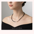 Necklace worn by a model with 'Silvissions' branding