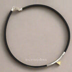 Black choker necklace with silver clasp on a gray background, featuring the brand 'Silvissions'.