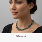 Woman wearing a necklace with a neutral background, featuring the brand 'Silvissions'.