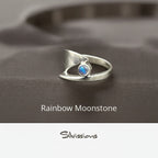 Silver ring with a rainbow moonstone on a neutral background, featuring the brand 'Silvissions'.