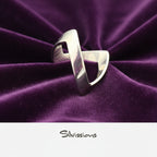 Silver ring with a unique design on a gray background, branded 'Silvissions'.