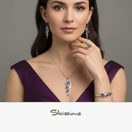A model wearing a handcrafted sterling silver and amethyst gemstone jewellery set, including earrings, ring, bracelet, and pendant.