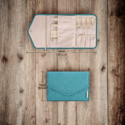 Teal jewelry organizer with measurements on a wooden surface